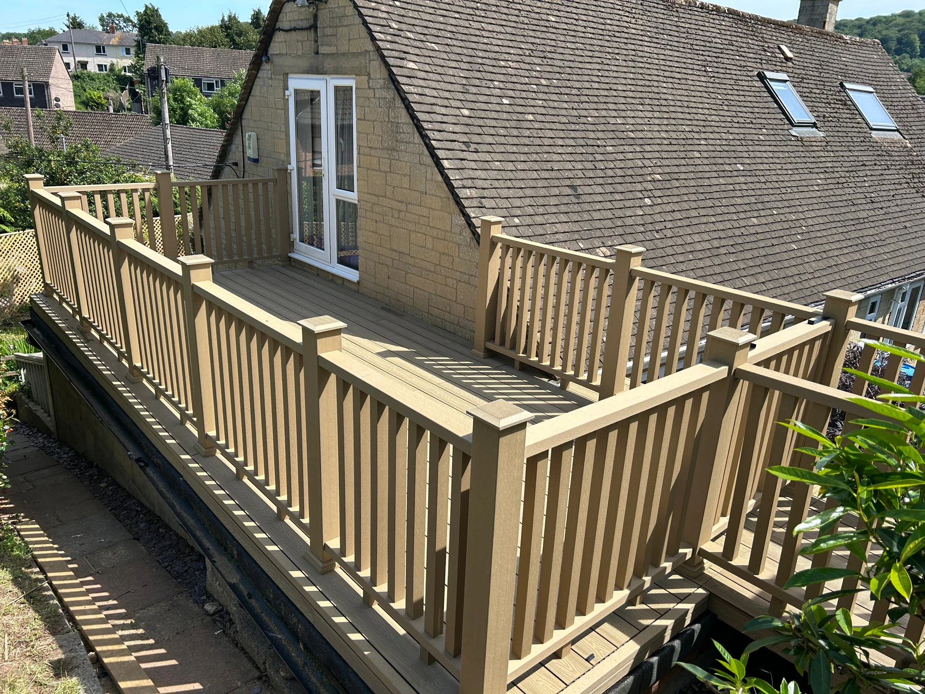 Finished composite decking boards with matching balustrade and hidden fixings
